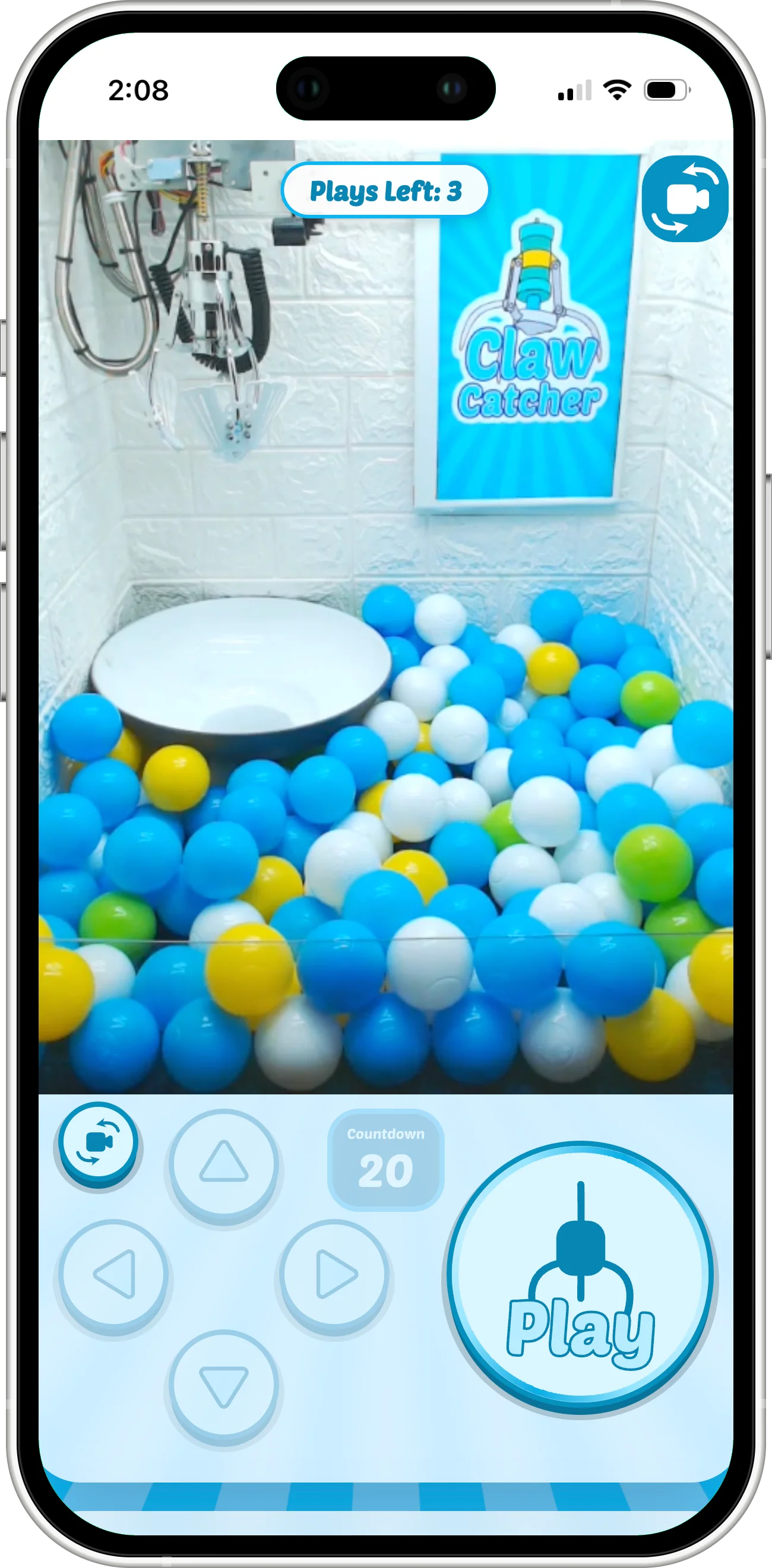 A real claw machine being played from a phone