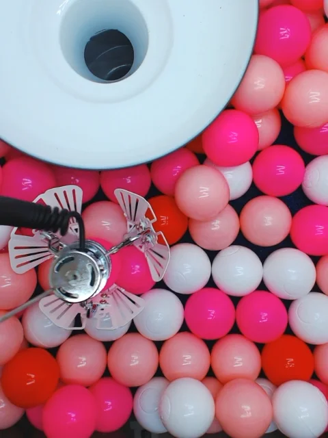 Bird's eye view of the claw cam on a real online claw machine on Claw Catcher's web app.